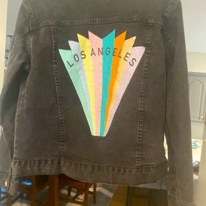 Pacsun Women’s black denim jacket with cool graphic on back . Medium.